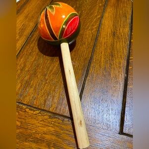 Colorful Wooden Maraca 11 inches long. Makes a delightful sound when shook. EUC